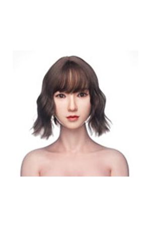 Irontech Hair Style J1, Shoulder-length wig in a soft chocolate brown shade. Featuring airy full bangs and playful textured waves, it creates natural-looking volume with a light, bouncy finish